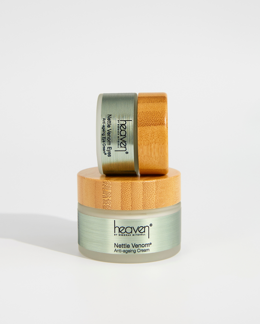 Two Skincare jars with bamboo lid on a white background