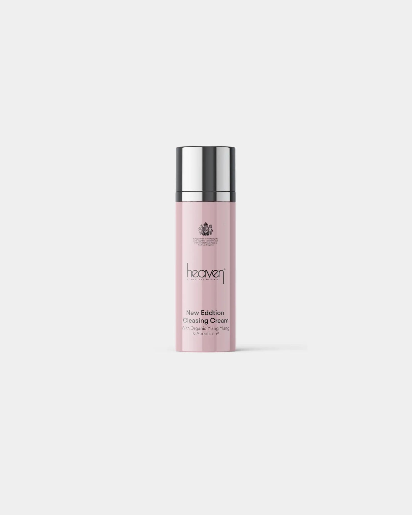 Heaven New Edition Cleansing Cream in a tall, light pink bottle with a silver cap.