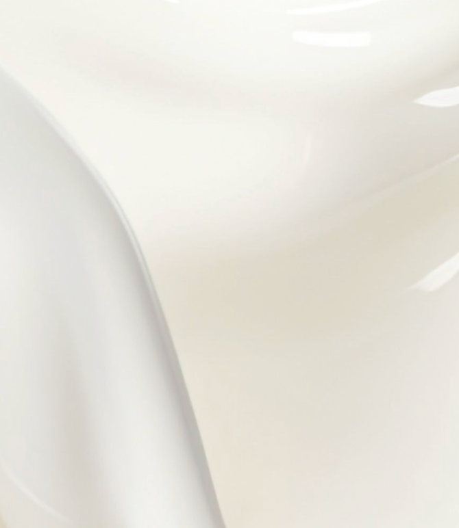 Close-up of a white cream product with a blurred background