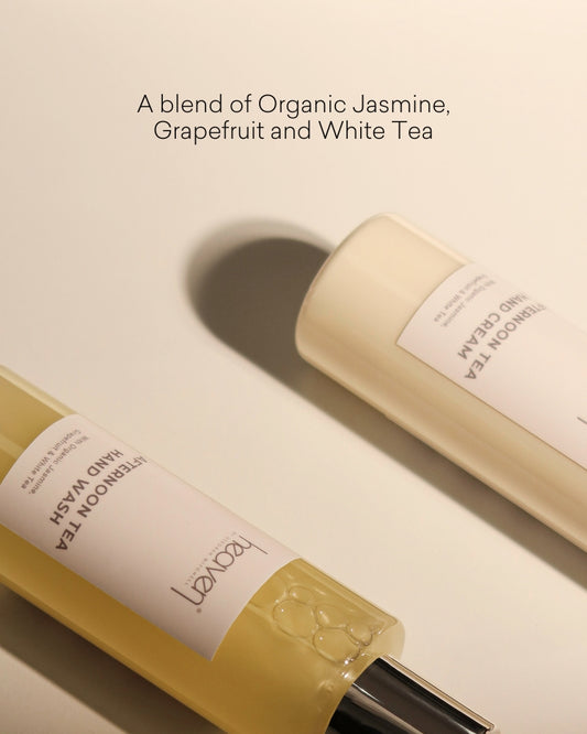 Close up of the products in the bottles lay flat on a white background.