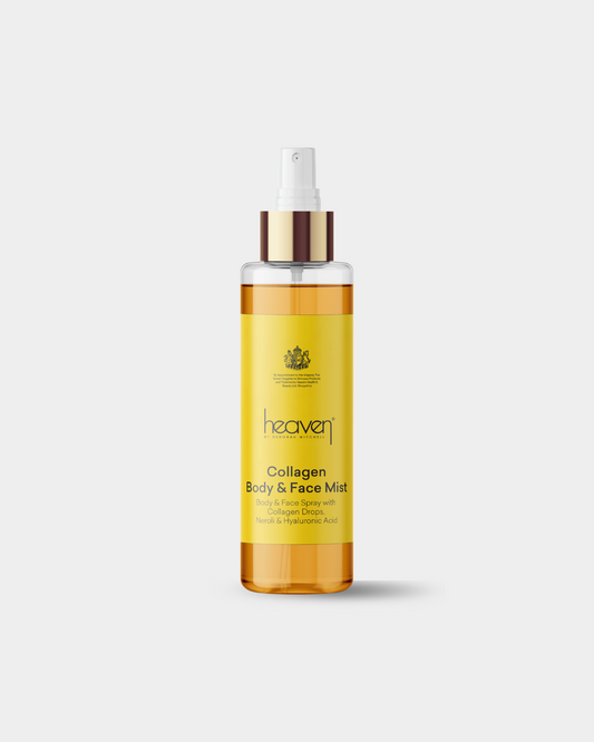 Bottle of heaven Collagen Body & Face Mist on a white background. Bottle has a bright yellow colour and the product itself is a rich golden tone.