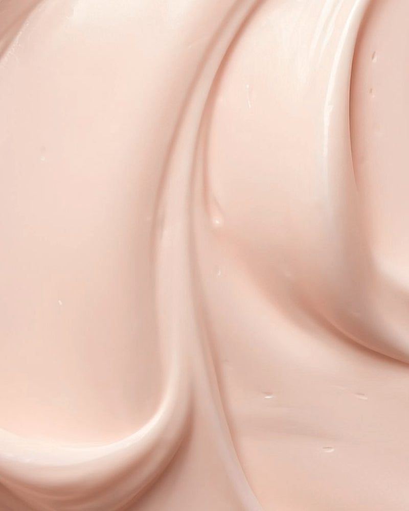 Close-up of smooth, light pink cream texture