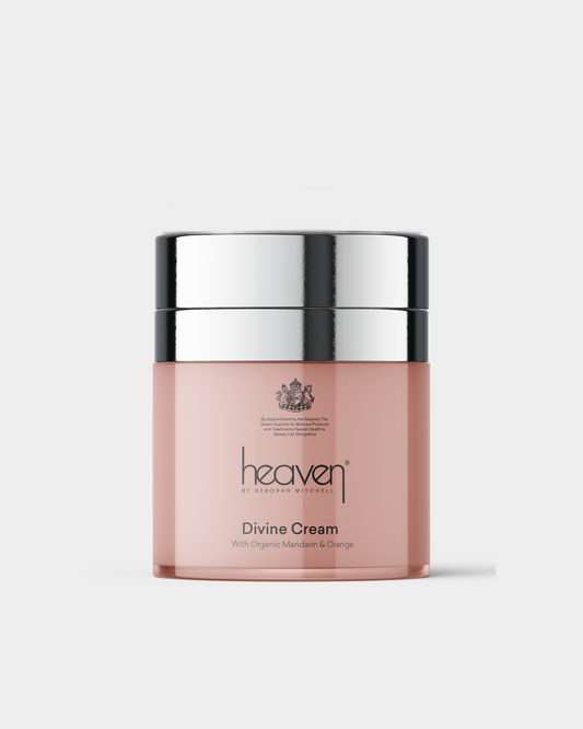 Pink jar of 'heaven' Divine Cream with silver lid on a white background