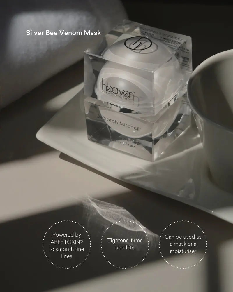 Silver Bee Venom Mask packaging on a dark surface with product details.