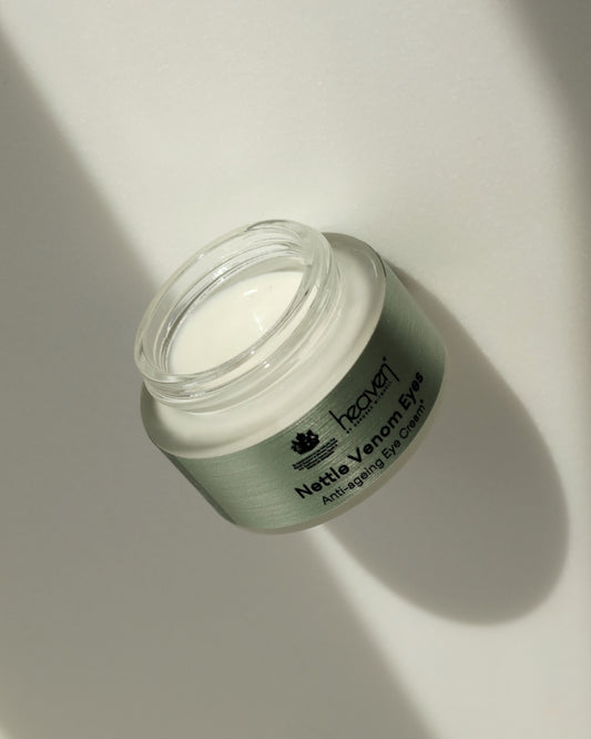 Jar of eye cream on a light background