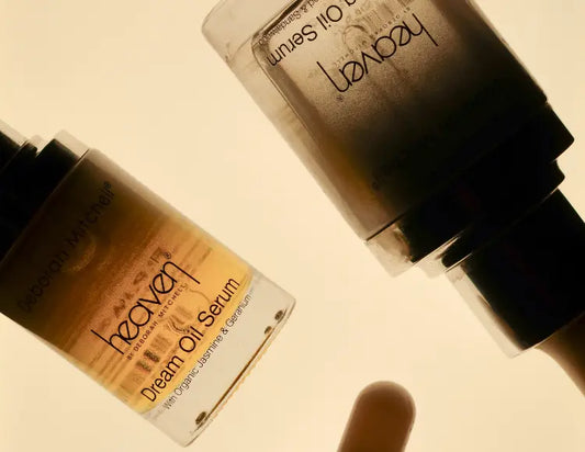 Heaven Skincare oil serums on a beige background.