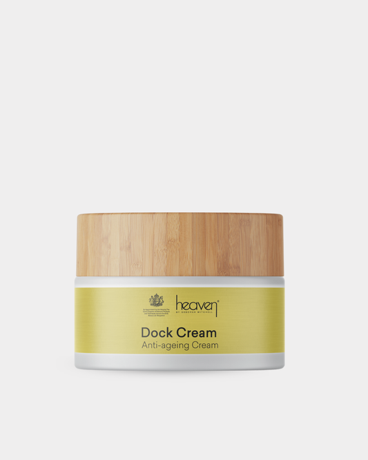 Anti-aging cream jar with wooden lid on a light gray background