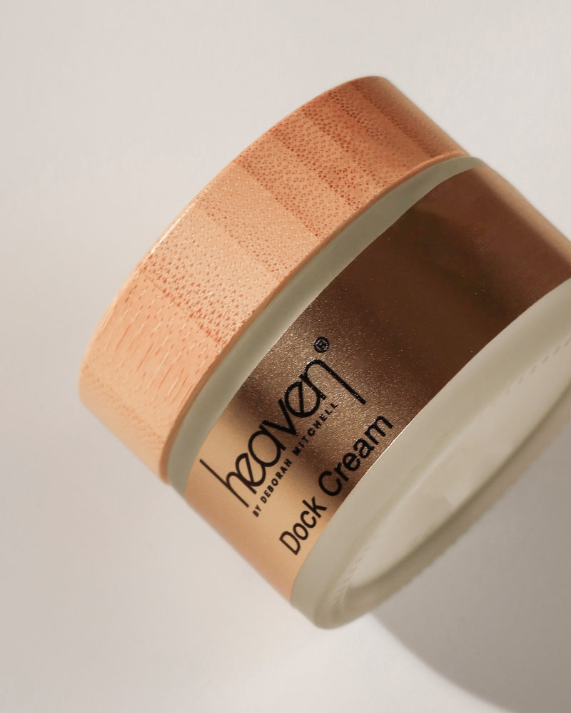 Jar of dock cream with on a light background