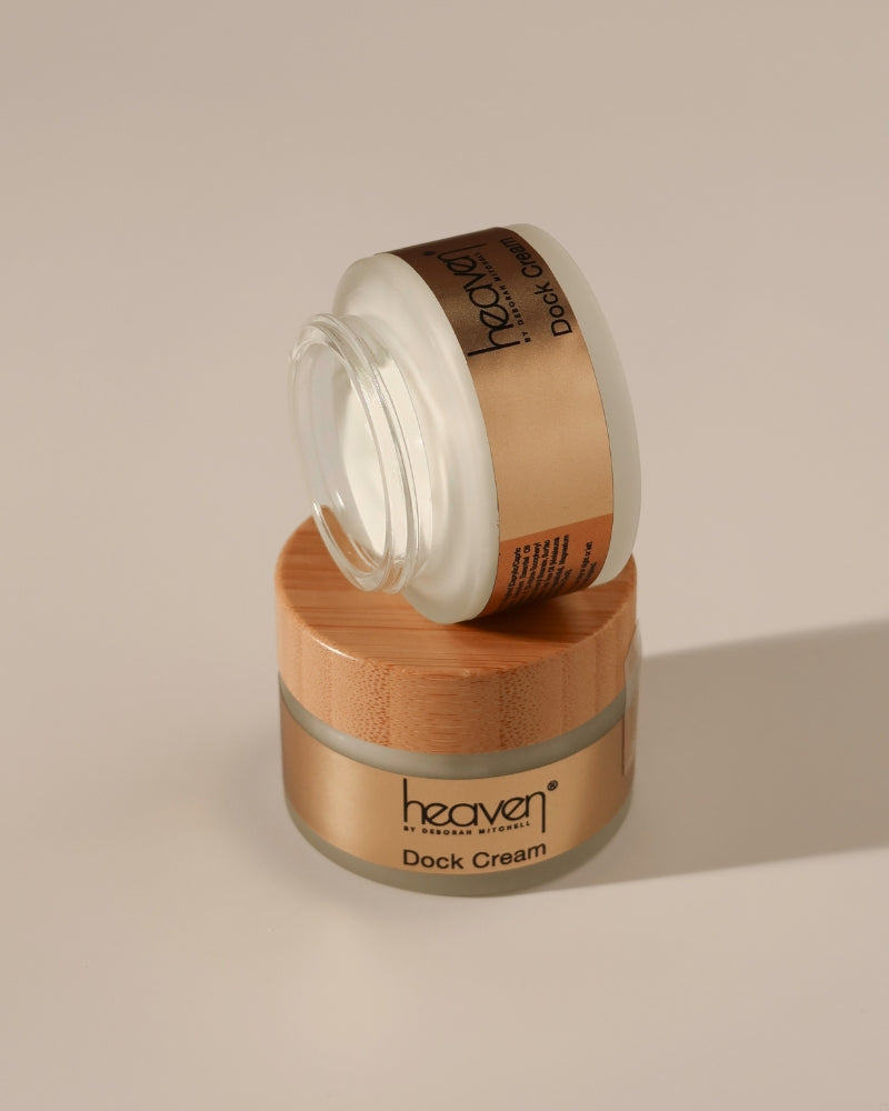 Two jars of 'heaven' dock cream on a beige background